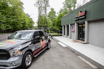 Storm Guard Truck parked in front of Storm Guard business
