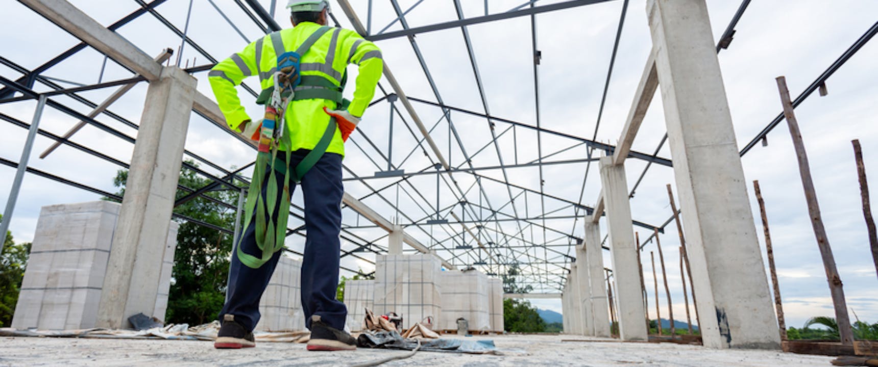 Commercial Roofer standing on commercial building