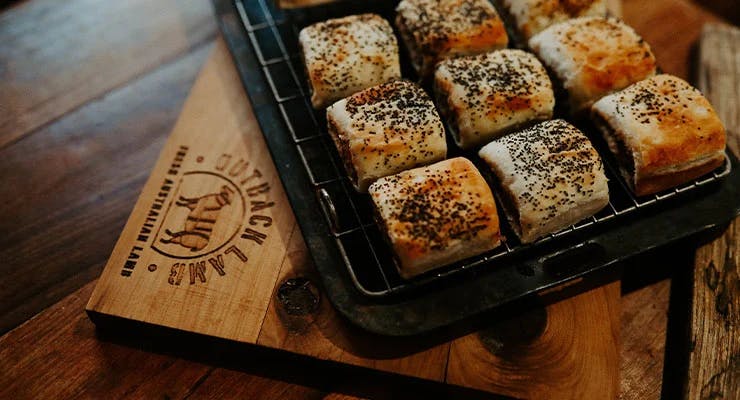 Outback Lamb sausage rolls on a wire over rack 