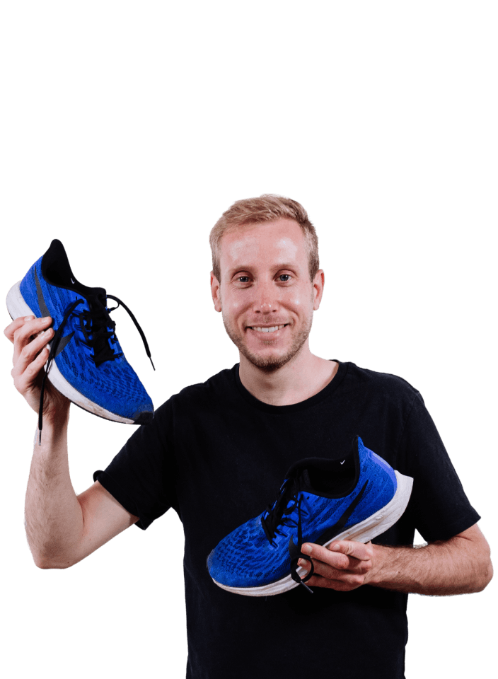 Stijn holding two blue running sneakers