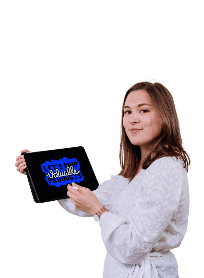 Lisa holding a tablet with a hand lettering design.