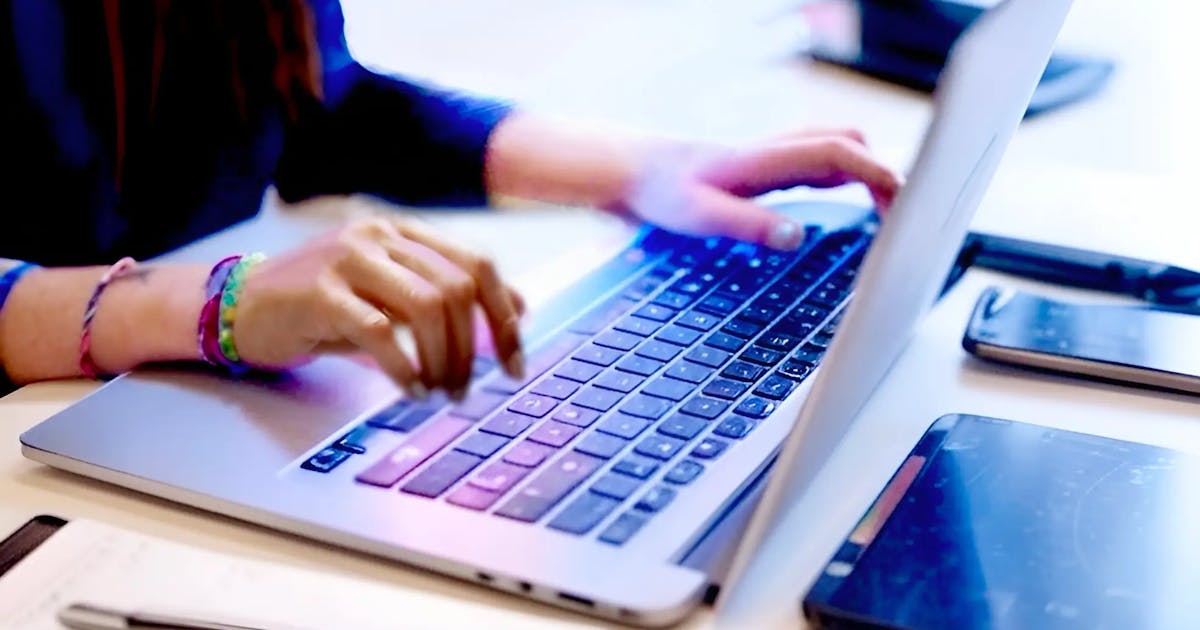 Software QA tester working on multiple devices