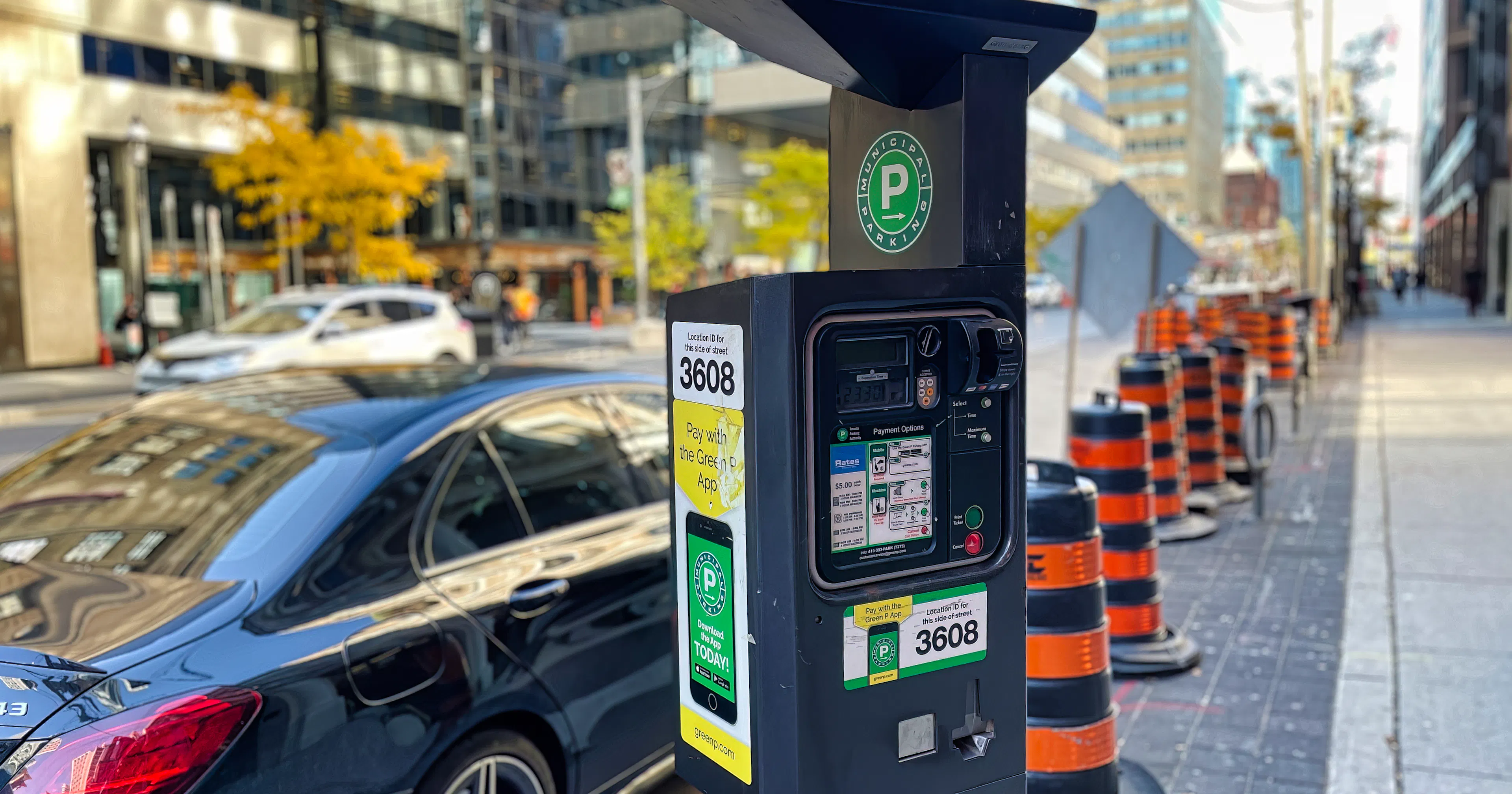 Street parking in Toronto with Green P meter and construction nearby