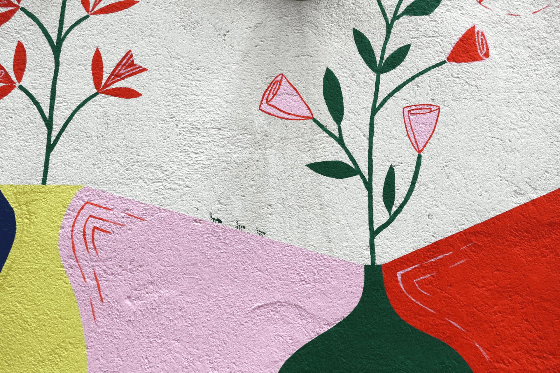 Détails de la peinture murale d'entrée de la ville de Loudéac, arborant des fourmis.
