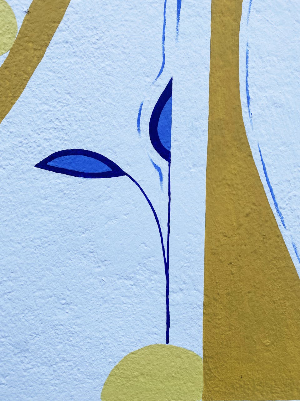 Détails de la fresque murale "Tisser du lien", illustrant une jeune pousse arrosée.