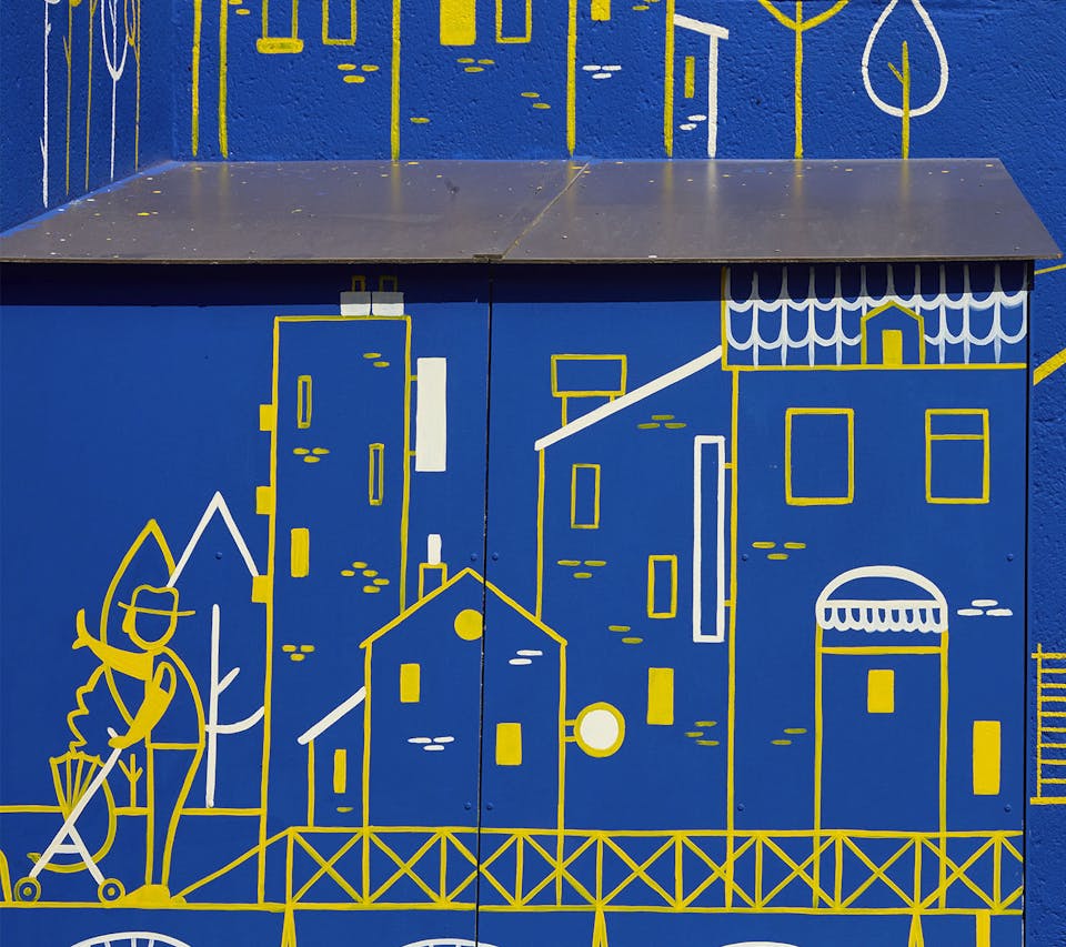 Street art fresque murale basée sur la nouvelle identité visuelle d'un quartier de l'Île de Nantes.
