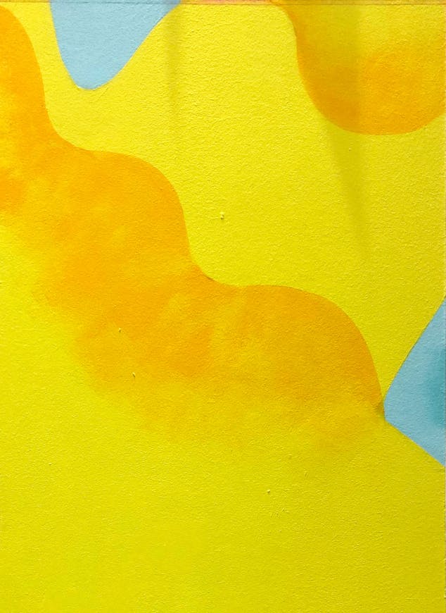 Réalisation de dégradés jaune au cœur d'une œuvre streetart.