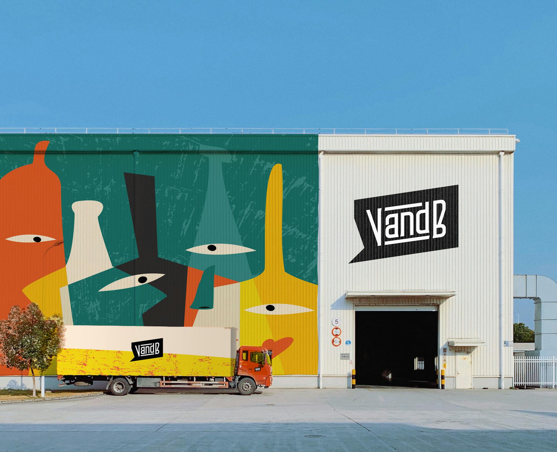 Un hangar et un camion à l'effigie de la nouvelle identité de marque du groupe V and B.