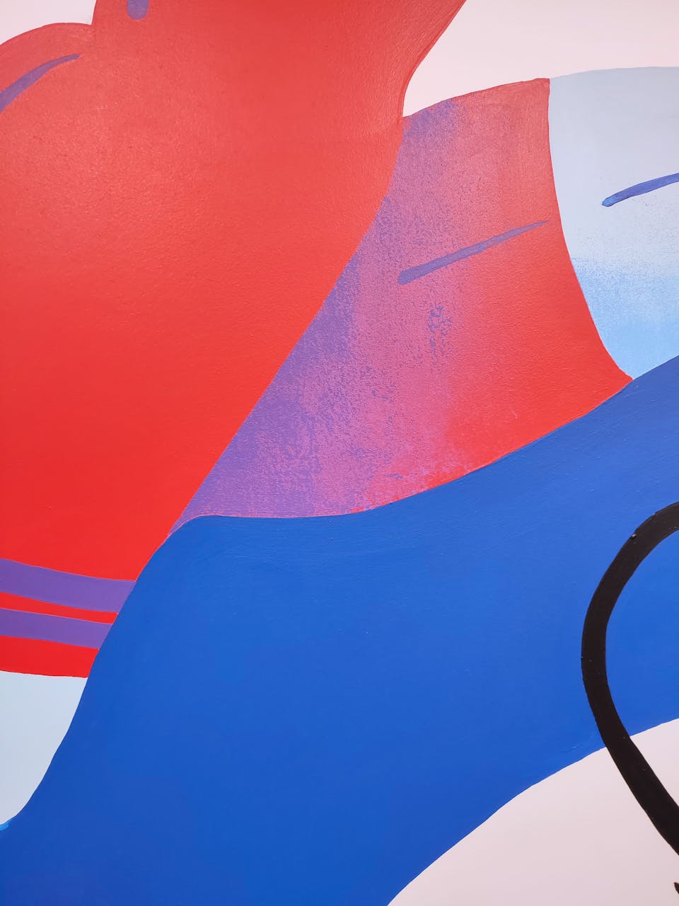 Zoom sur l'une des fresques de l'agence de design graphique Studio Katra au sein d'Intersport Paris-les-Halles, représentant les jambes et le short d'un coureur.