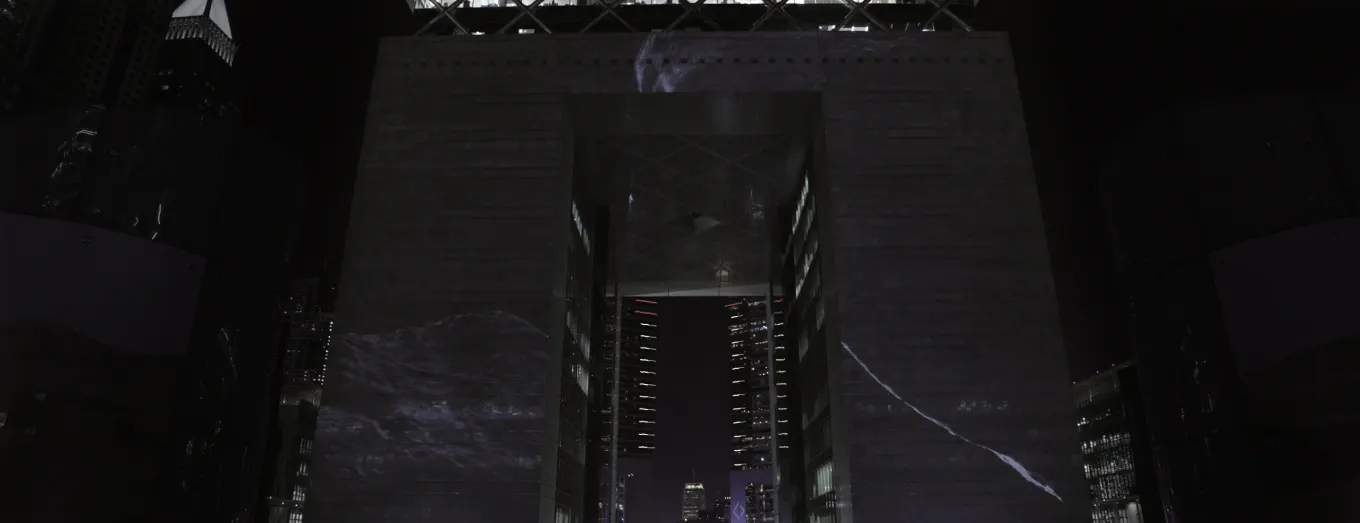 3D motion film projected onto a monumental arch at DIFC Quarter, Dubai, at night