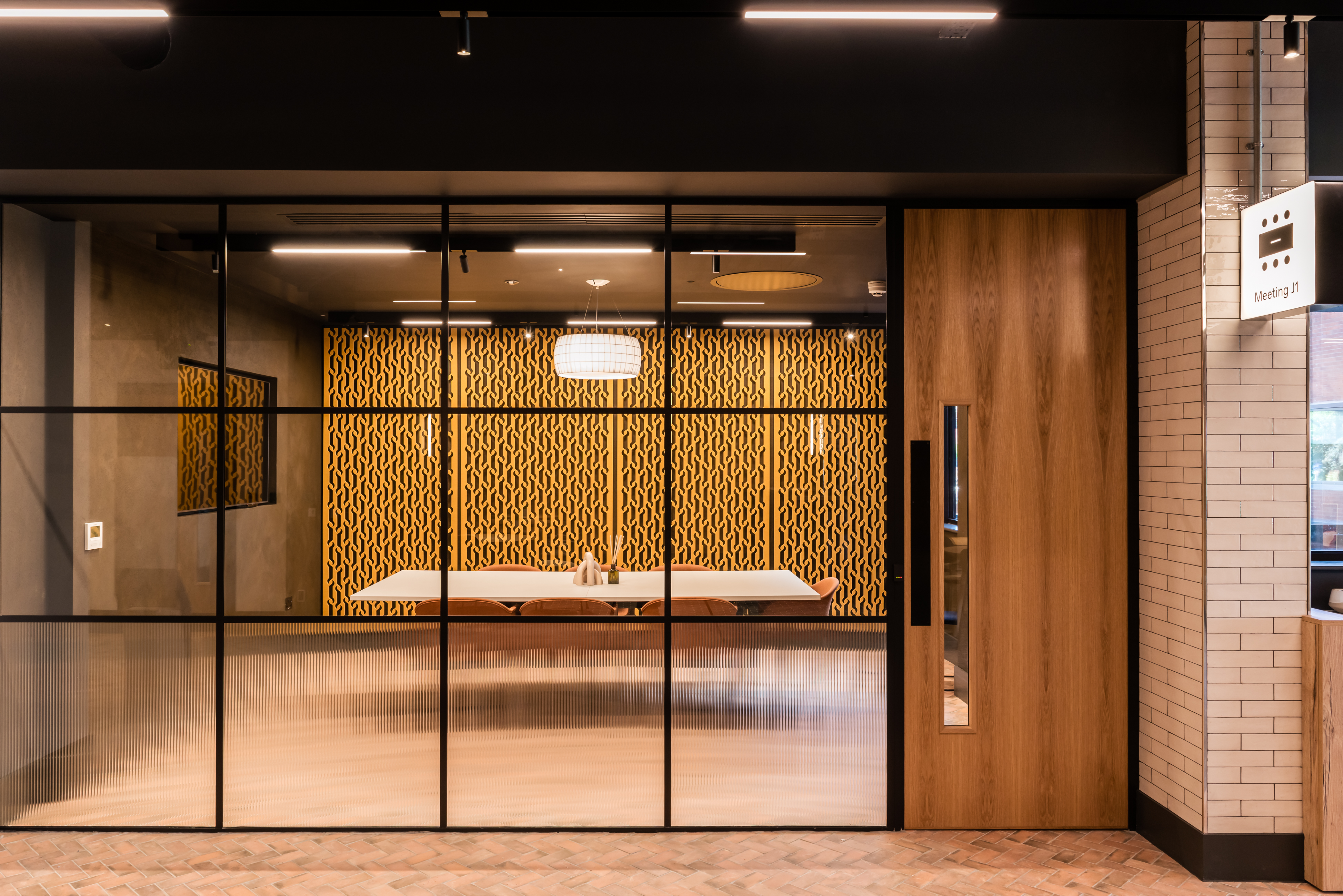 A meeting room with an internal glass wall.
