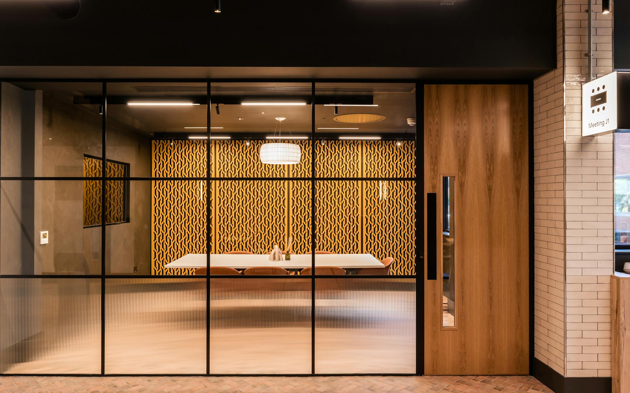 A meeting room with an internal glass wall.