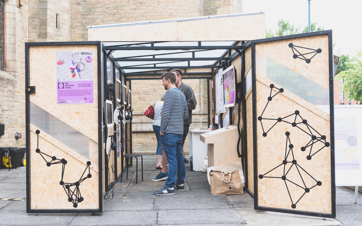 Picture of people viewing the This Place Of Mine physical installation.