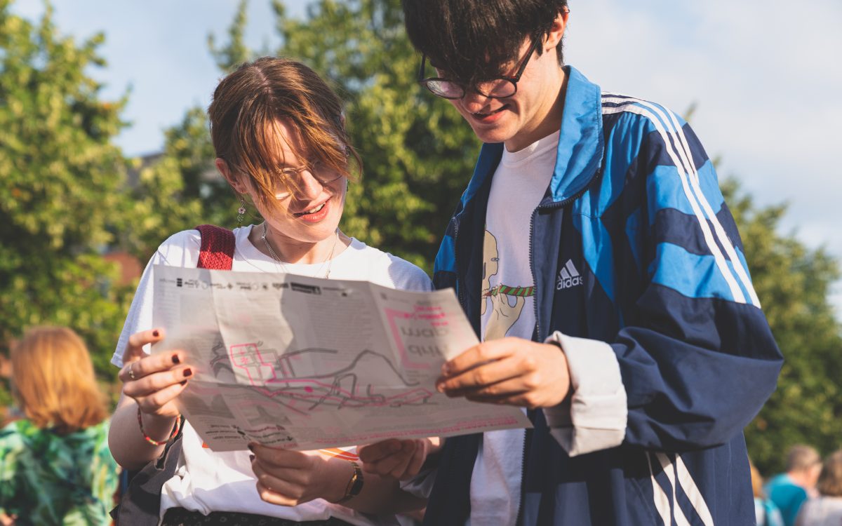 Picture of people looking at a map from the This Place of Mine project.
