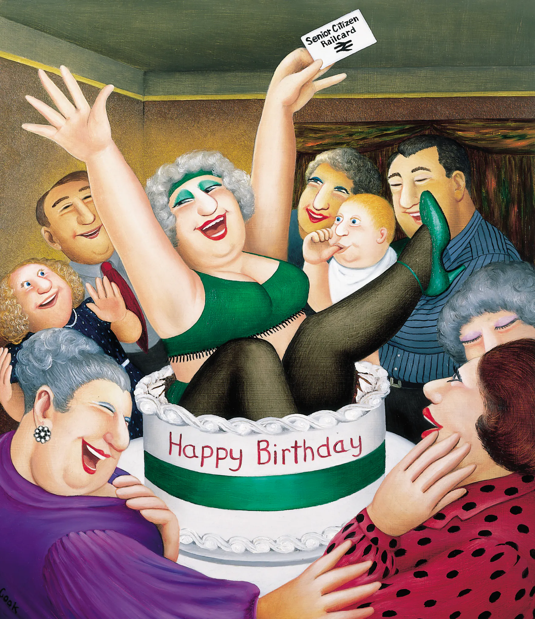A joyful elderly woman in green underwear leaps from a giant birthday cake labelled “Happy Birthday,” holding a “Senior Citizen Pass Card.” She is surrounded by smiling, laughing friends and family; a baby looks up at her as confetti falls in a festive room.