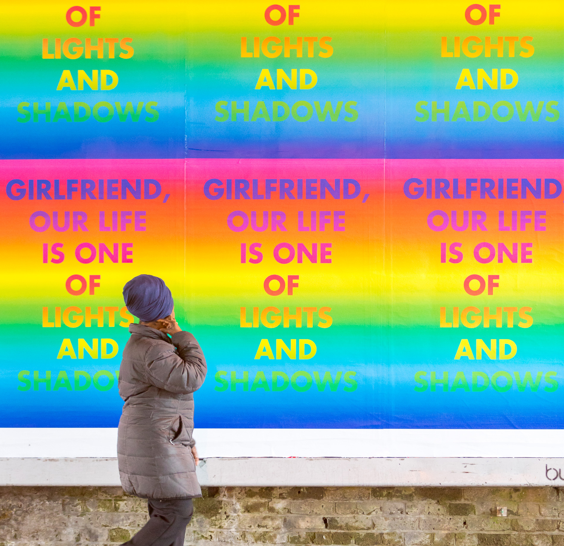 Installation view of David McDiarmid's "Rainbow Aphorisms" displayed on Clapham High Street in 2017, featuring bold, colourful text-based artworks with LGBTQ+ affirmations and slogans.
