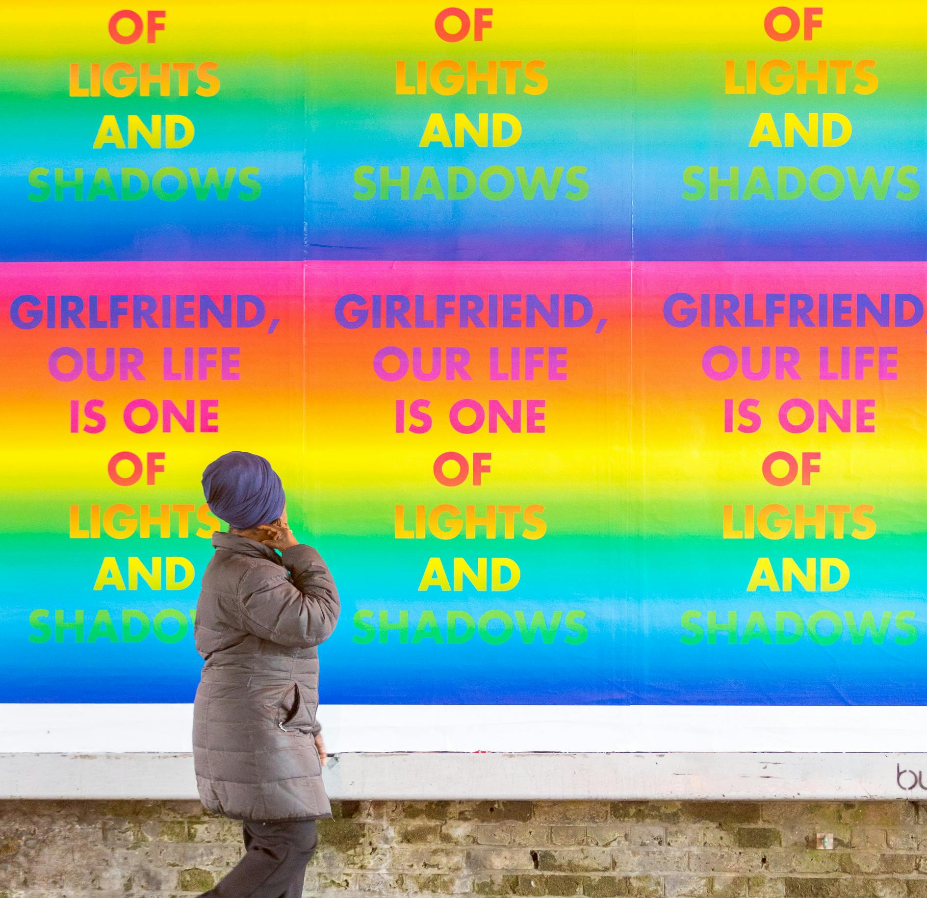 Installation view of David McDiarmid's "Rainbow Aphorisms" displayed on Clapham High Street in 2017, featuring bold, colourful text-based artworks with LGBTQ+ affirmations and slogans.