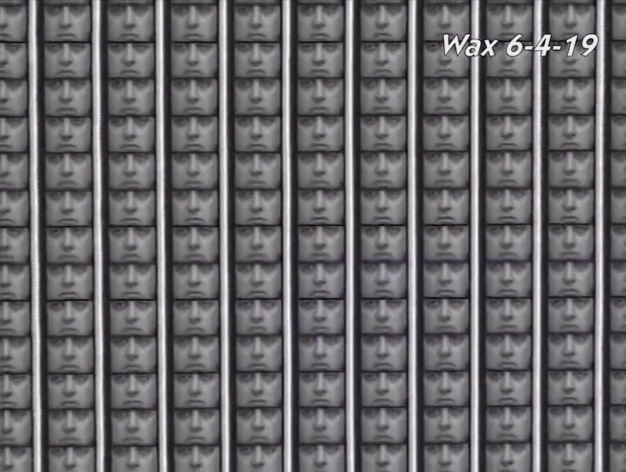 A grid of monochromatic faces resembling a mask. Each face appears identical and is aligned in rows and columns. The date "6-4-19" is written in the top right corner with the word "Wax" above it.