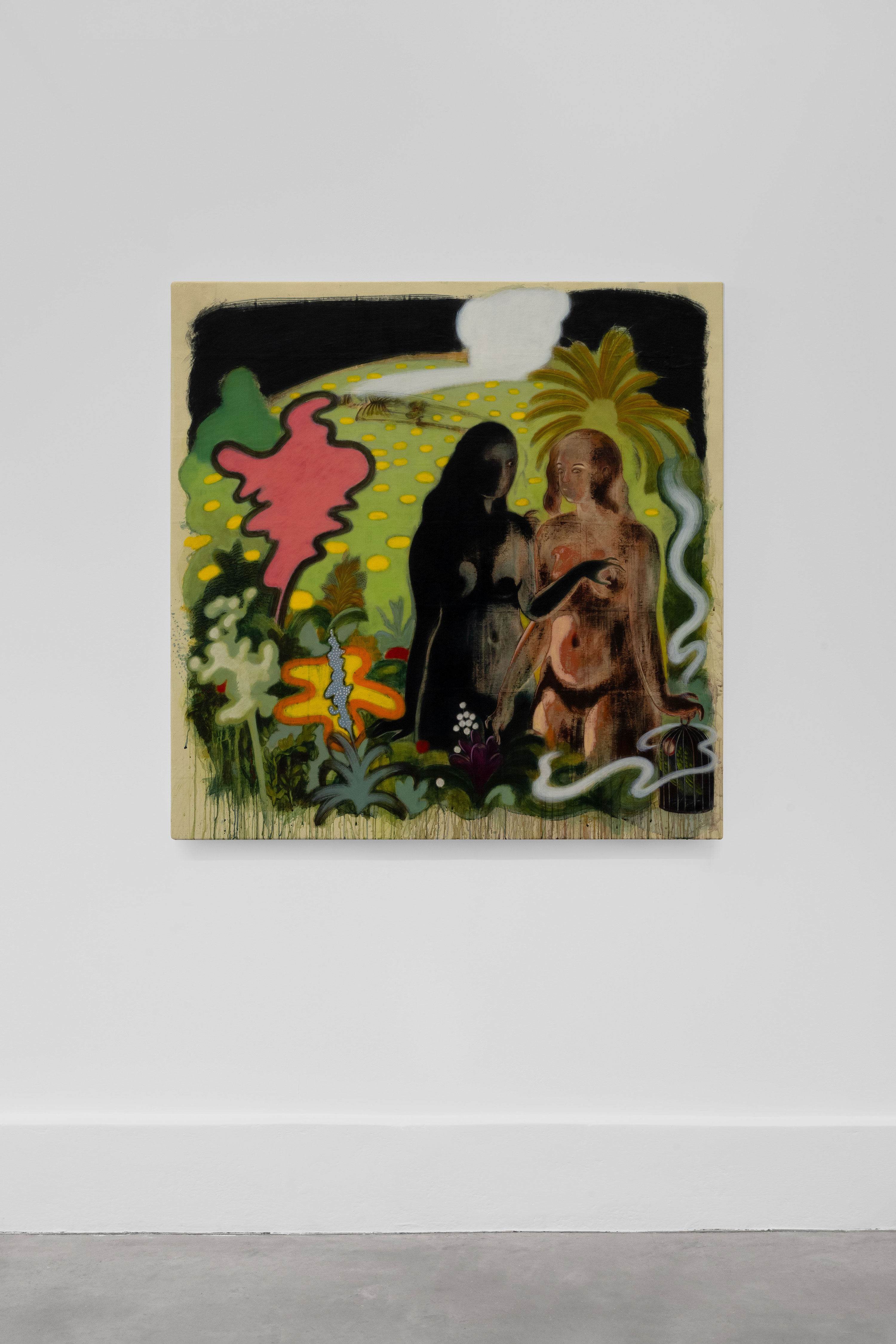 A colourful painting hangs on a white wall, depicting two human-like figures—one dark, one nude—surrounded by surreal plants, abstract shapes, and a white sun or moon in a yellow sky. The artwork features bold outlines and a dreamlike, mystical atmosphere.