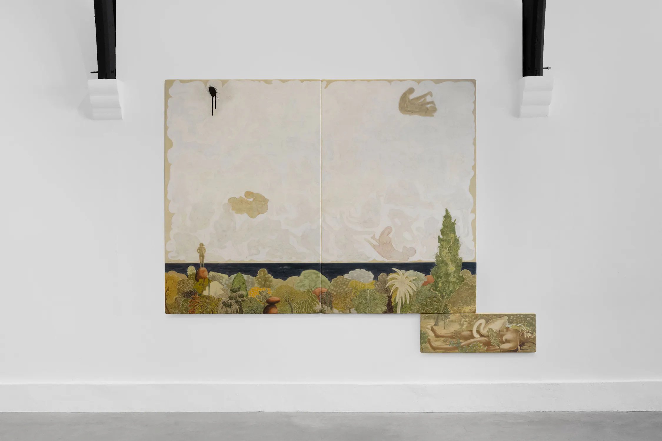 A large, two-panel painting hangs on a white wall above a smaller rectangular painting. The artwork depicts a lush, detailed landscape with greenery, trees, and abstract cloud-like forms against a pale, swirling sky. Black beams are visible above the art.