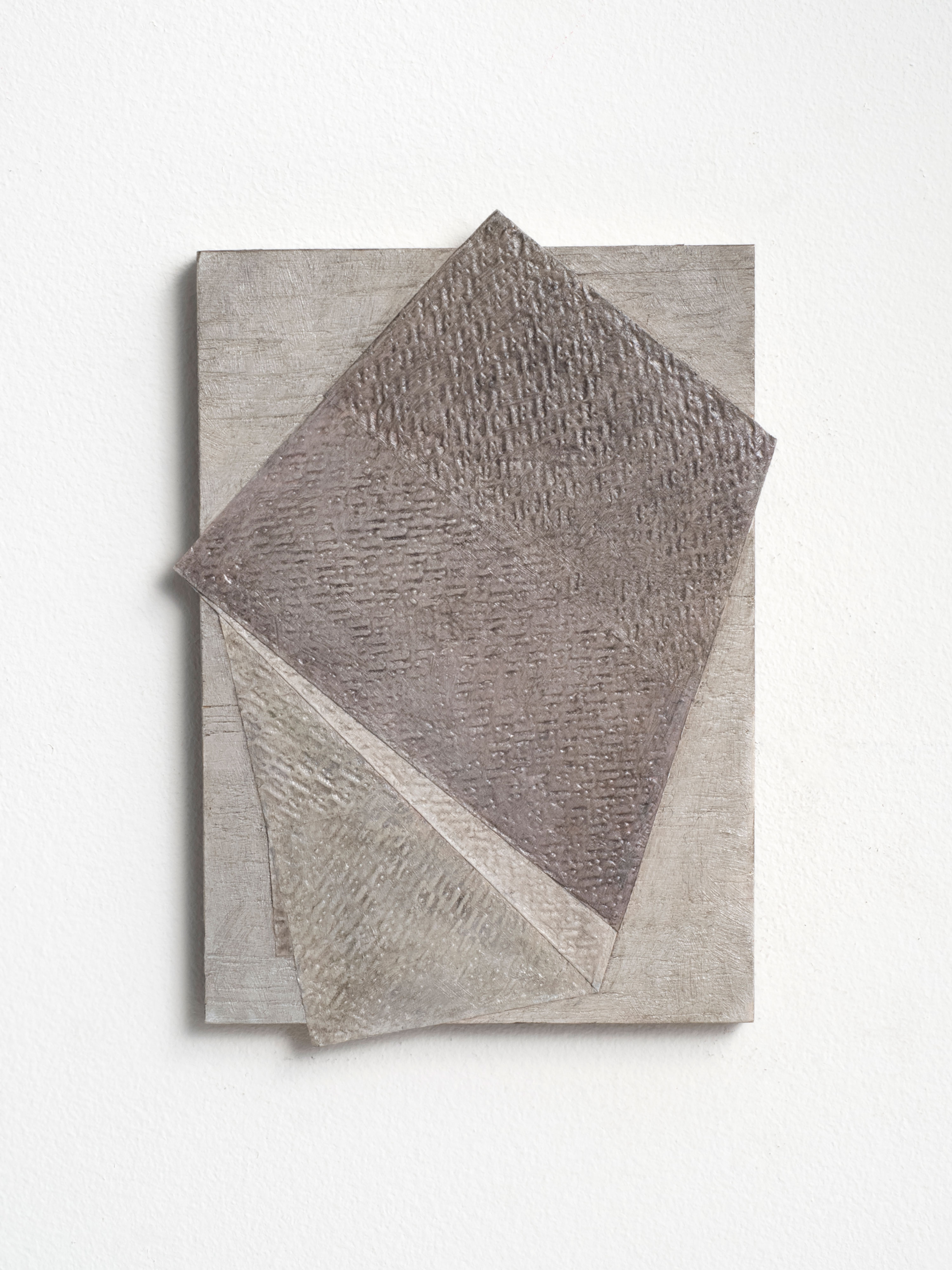 A textured, abstract artwork with three overlapping, raised quadrilateral shapes in muted beige and grey tones, arranged on a rectangular canvas. The layered surfaces feature subtle linear patterns, creating depth and shadow against a white background.