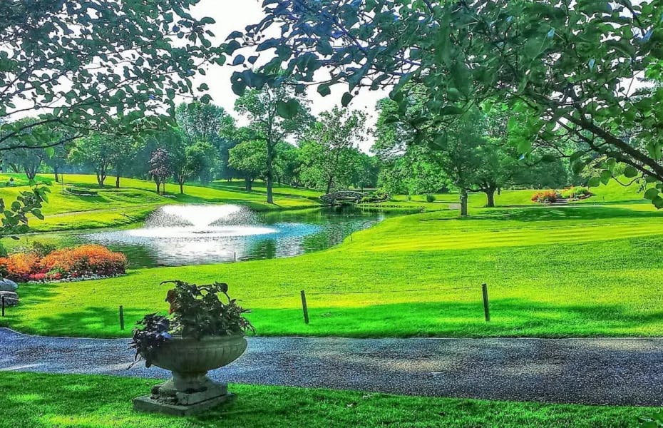 Stonycraft Bloomfield Hills, Michigan featuring vibrant plants and a decorative water fountain.