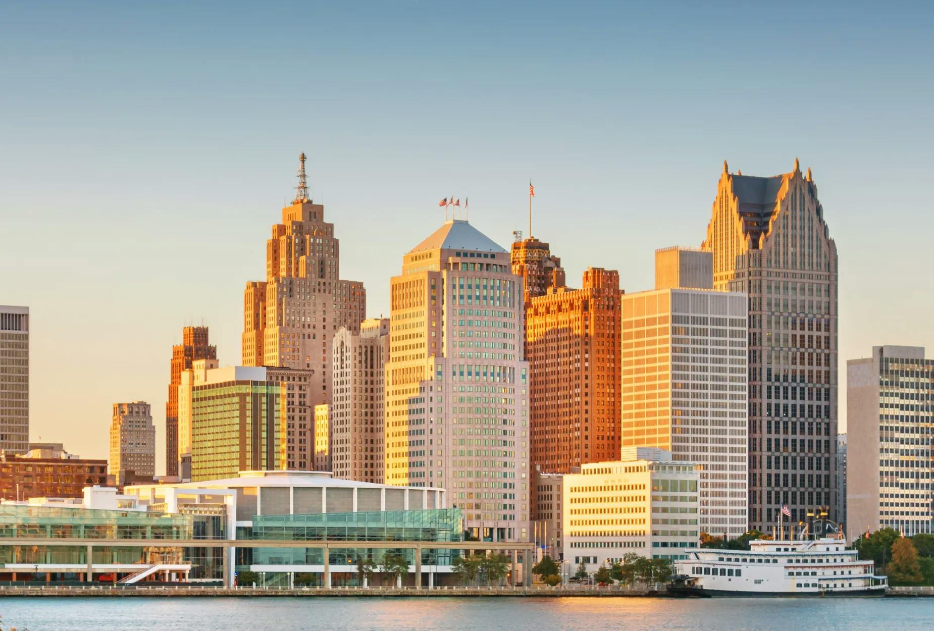 View of Livonia, Michigan featuring modern buildings and sky towers under a bright blue sky with scattered clouds, showcasing the city’s urban skyline and architecture.