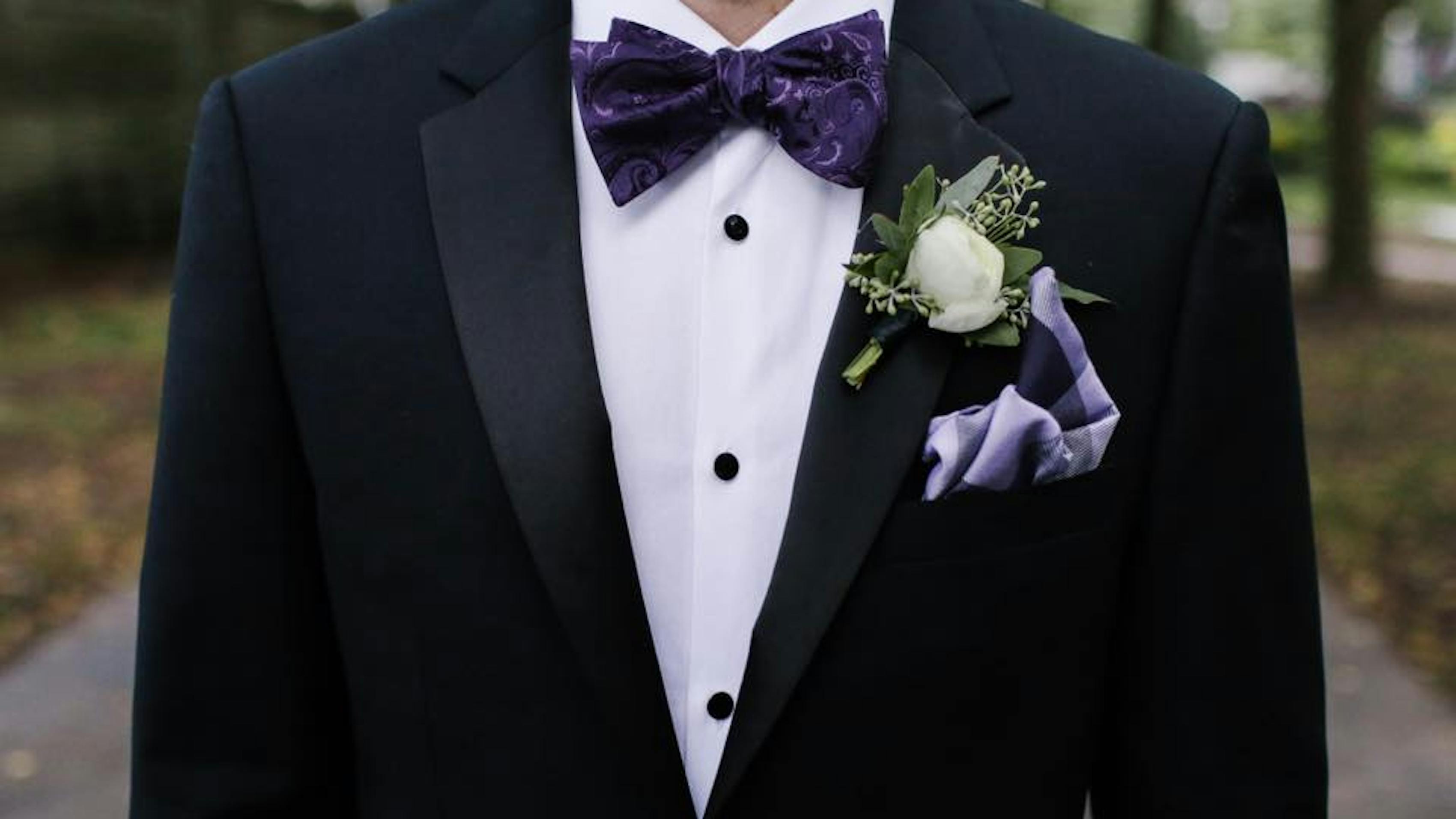 groom in wedding tuxedo jacket