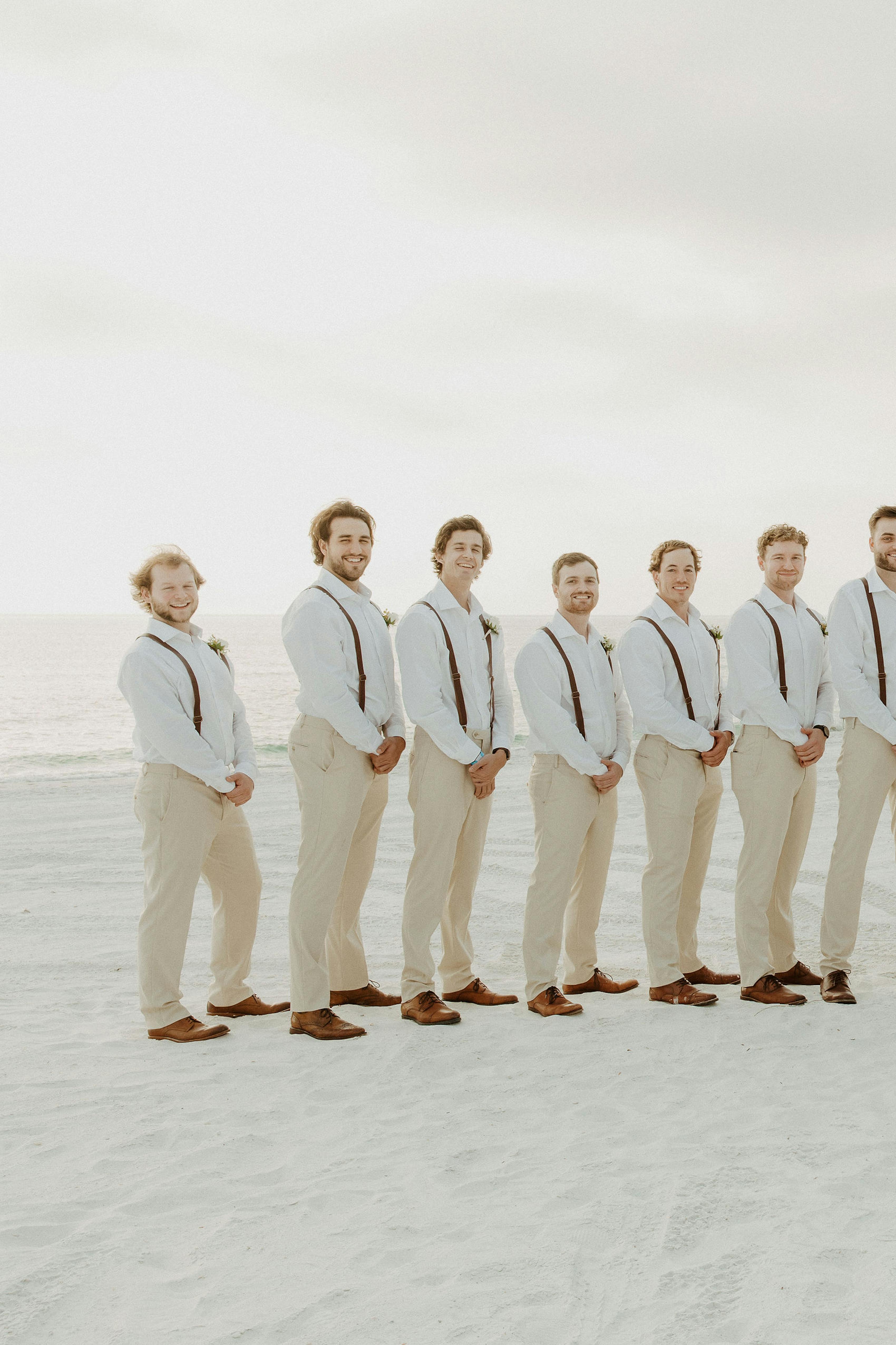 tan suits for a beach wedding