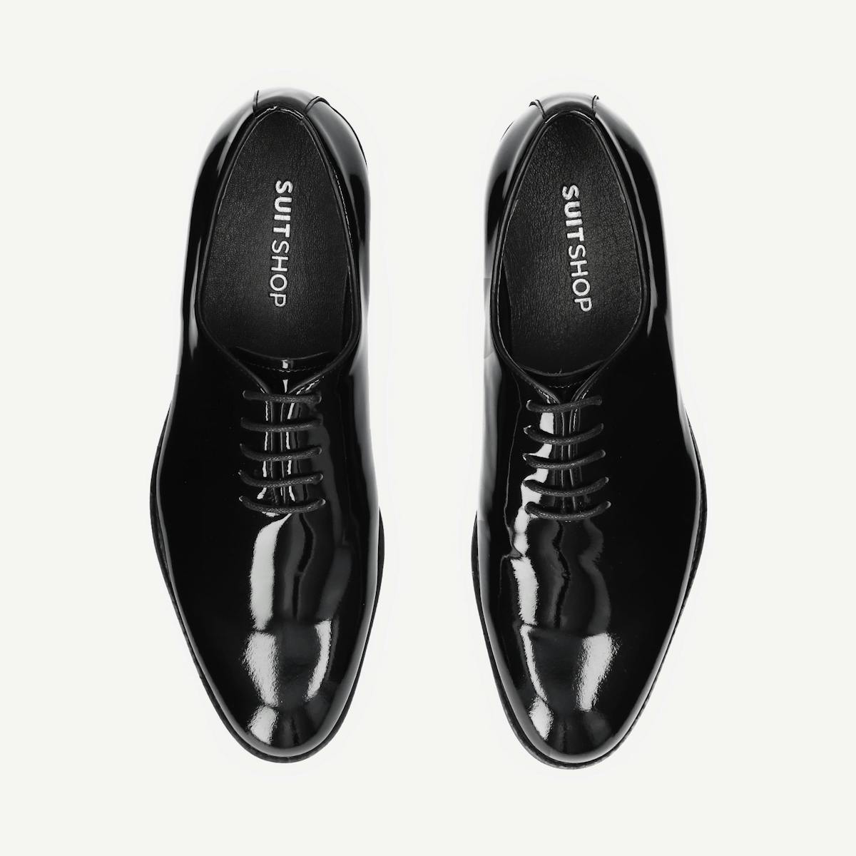 Patent leather tuxedo shoes help make an outfit festive.