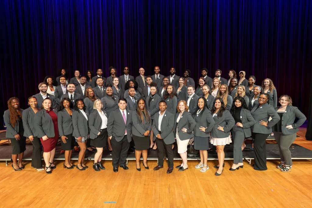 Law school students wearing SuitShop charcoal gray blazers in b2b suiting partnership.