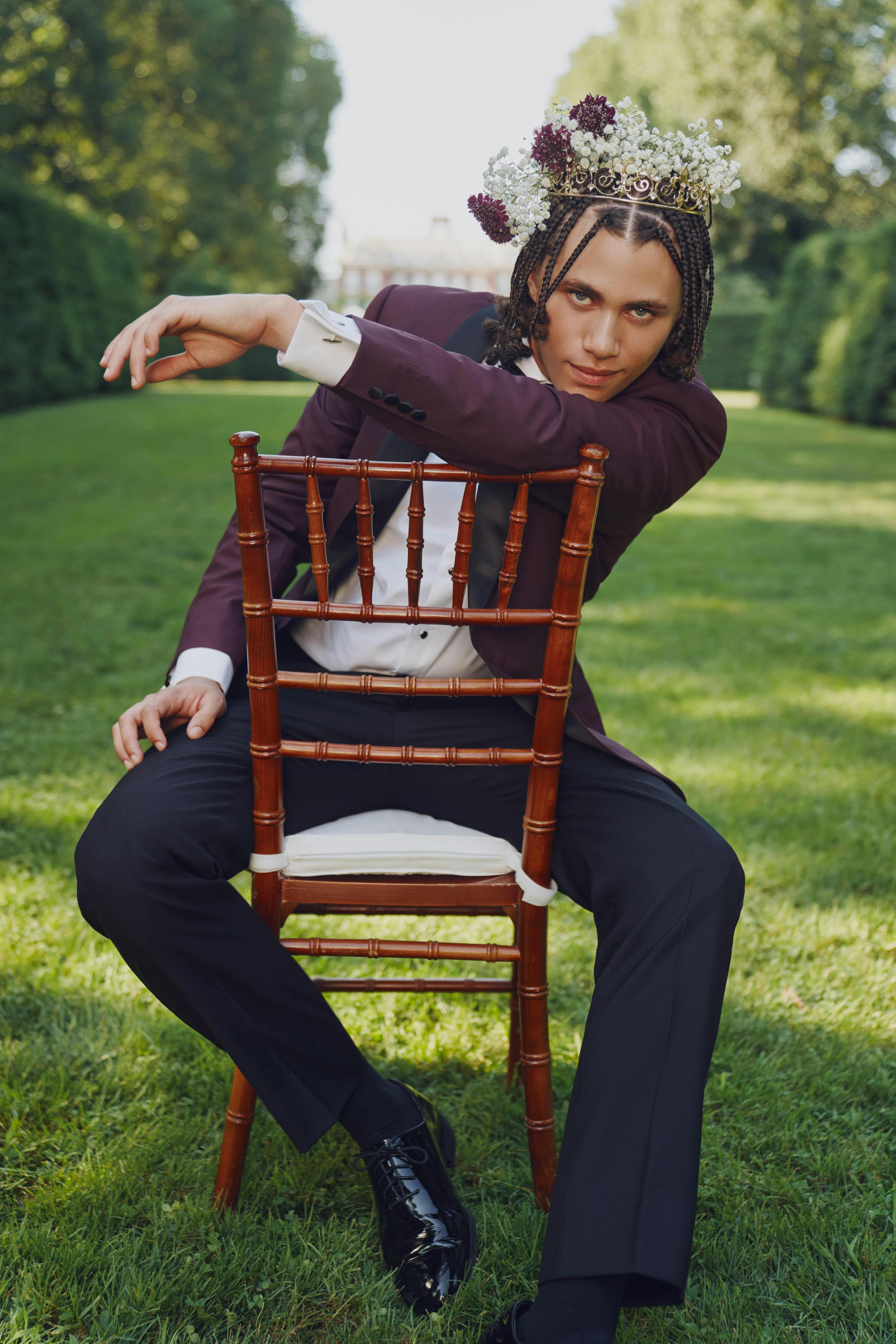 Burgundy tuxedo jacket for guy's homecoming 2022 outfit plus flower crown.
