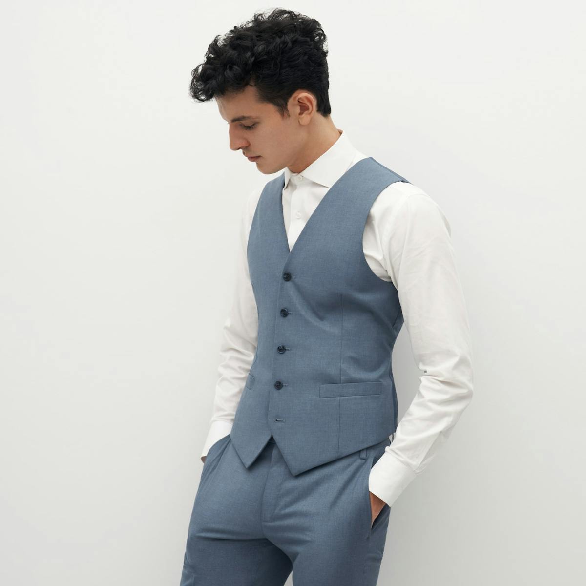 Light blue suit vest for menswear holiday party outfit.