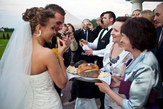 Shown here, the tradition of sharing bread, salt, and vodka, is a popular wedding tradition in many of the Baltic countries.
