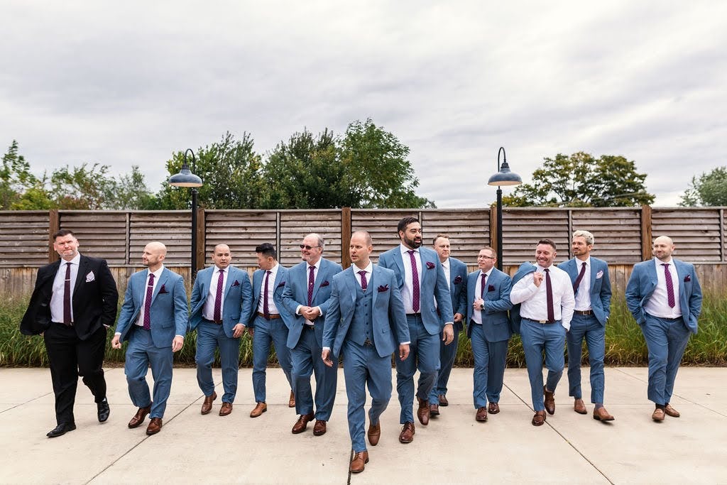 Tips on selecting the right blue suit color for your wedding party based on your bridesmaid dress