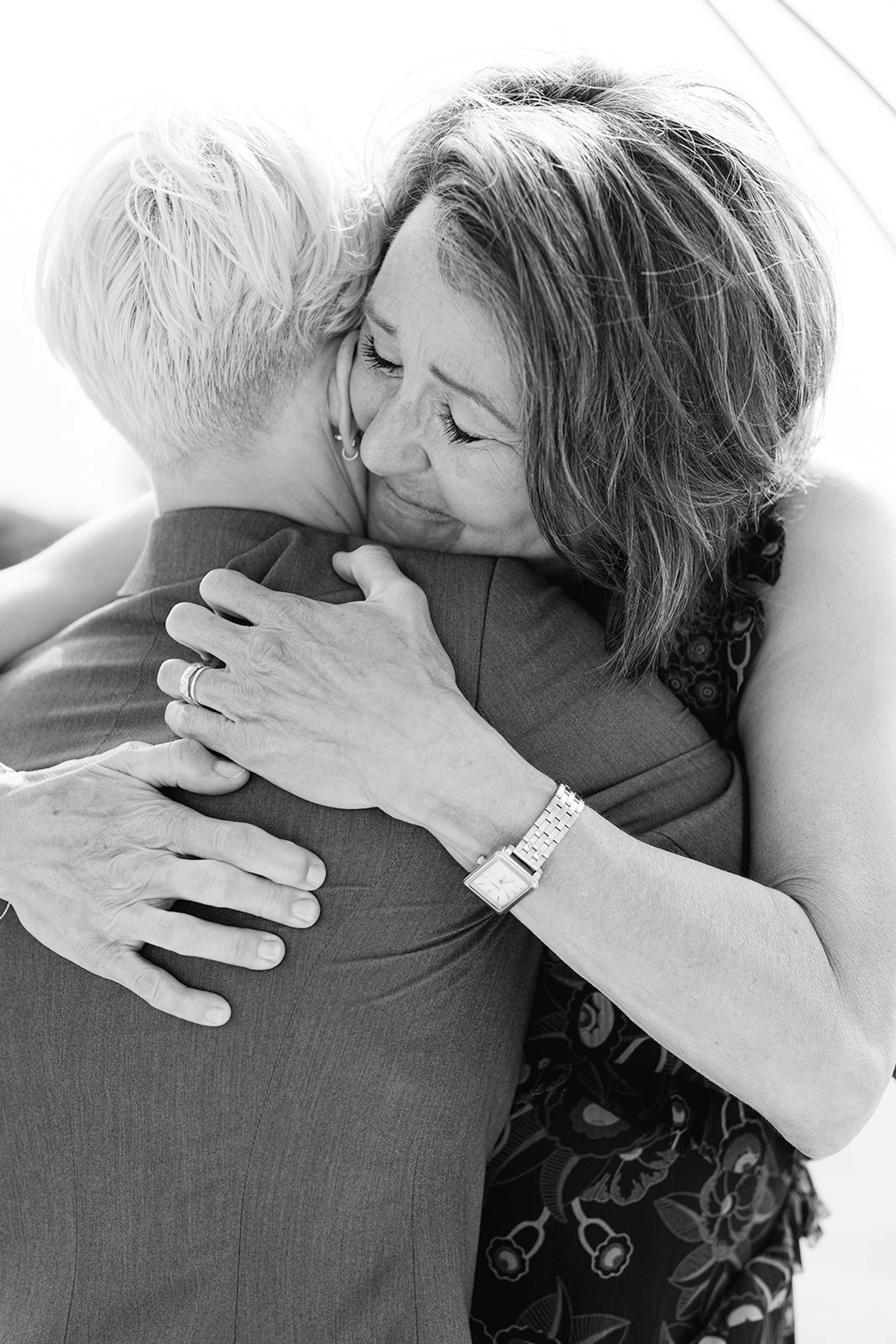 Sal and her mom hug on Sal's wedding day.