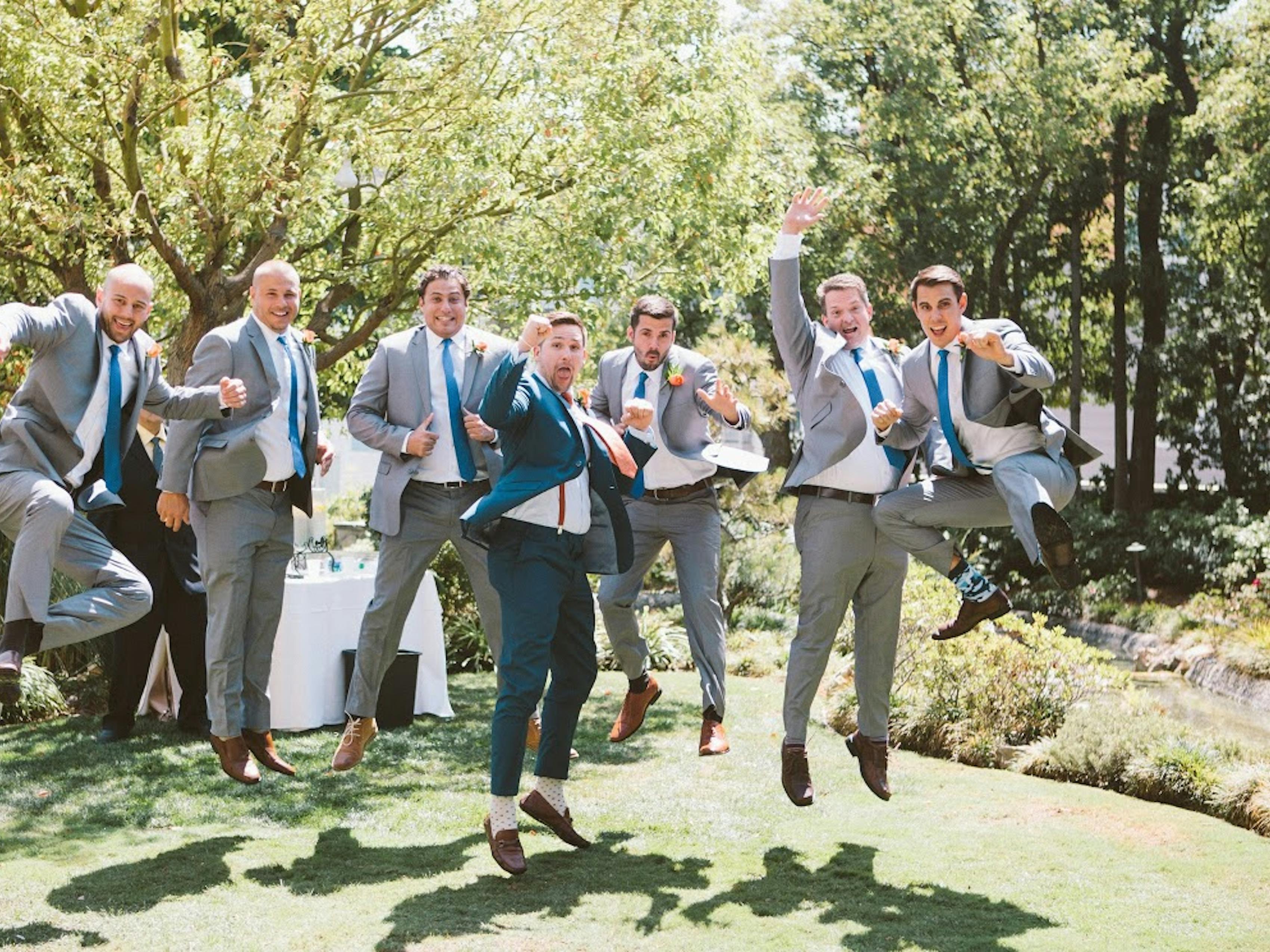 groomsmen in gray suits and brown shoes