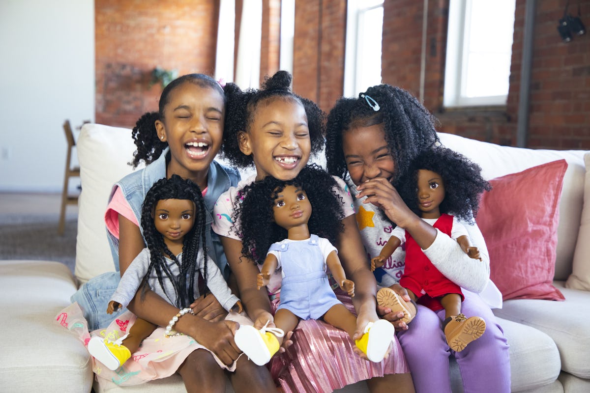 Young girls with natural curls and their Healthy Roots Dolls