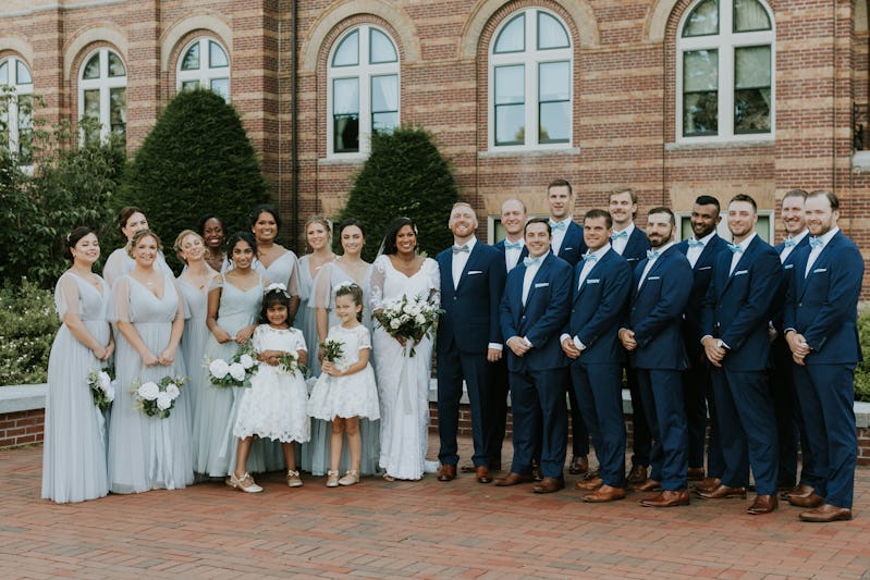 spring wedding with light gray bridesmaids dresses and navy groomsmen suits