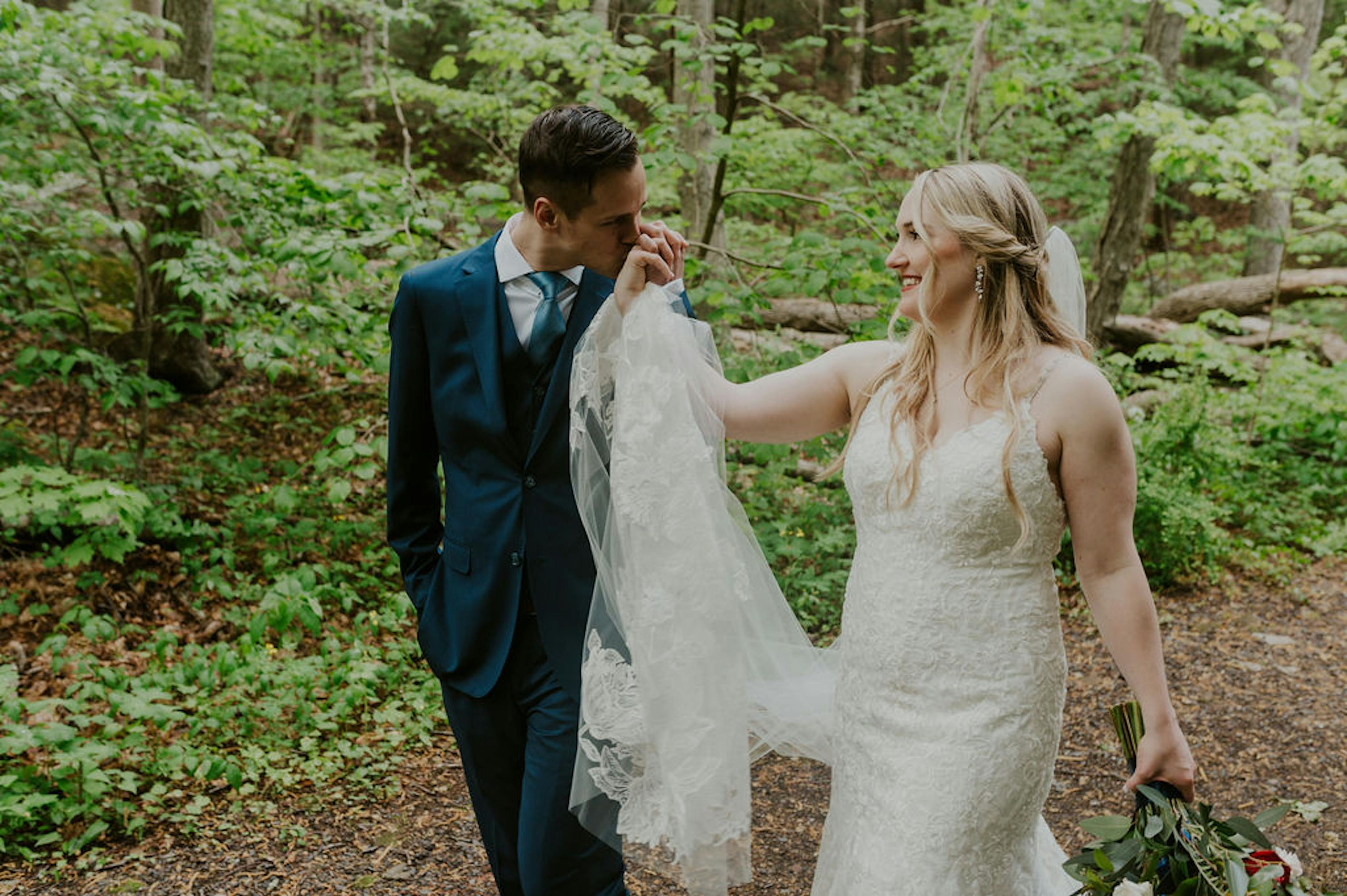 Bride and groom in a brilliant blue suit