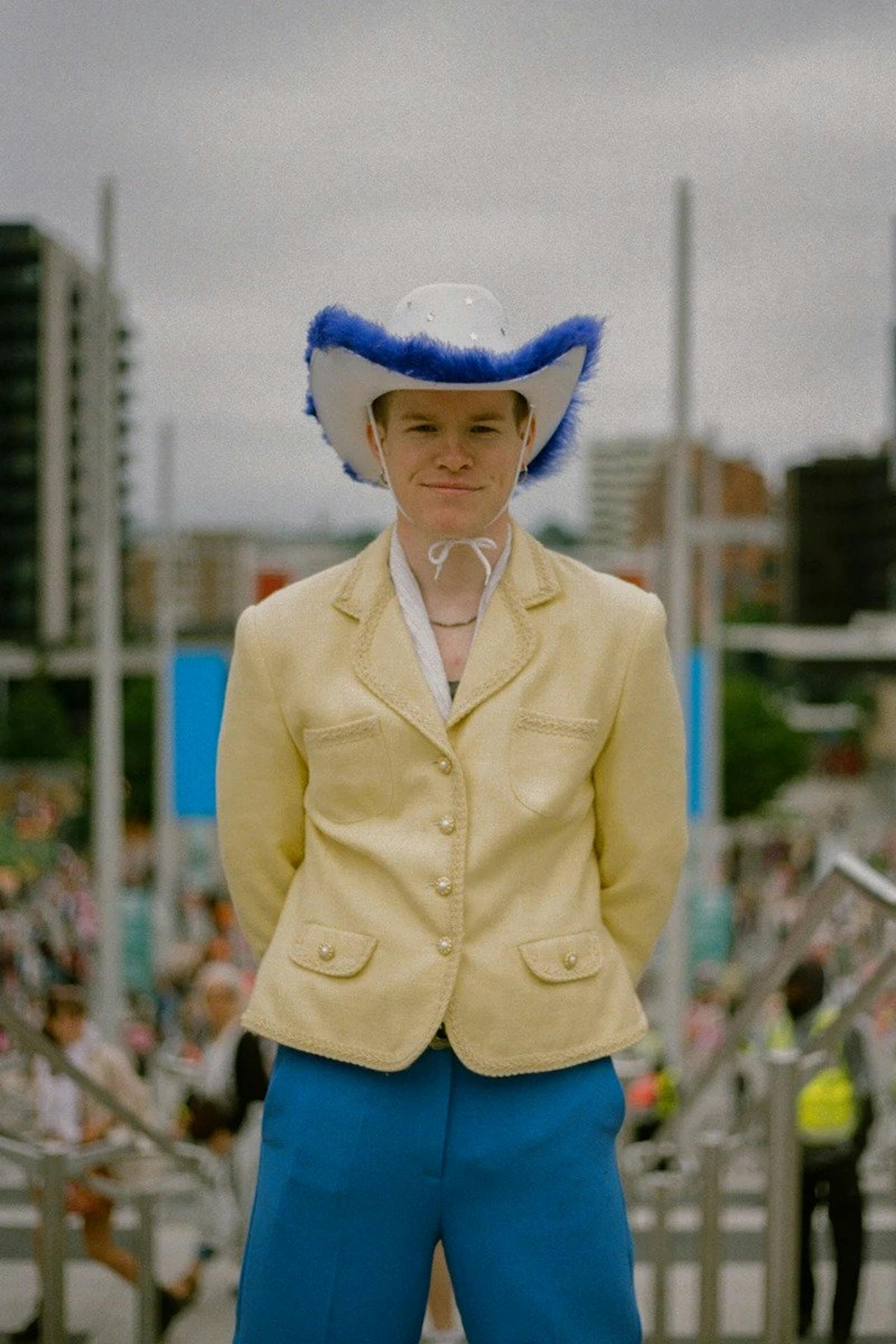 Suit and cowboy hat guy's fan concert outfit at Harry Styles Love on Tour