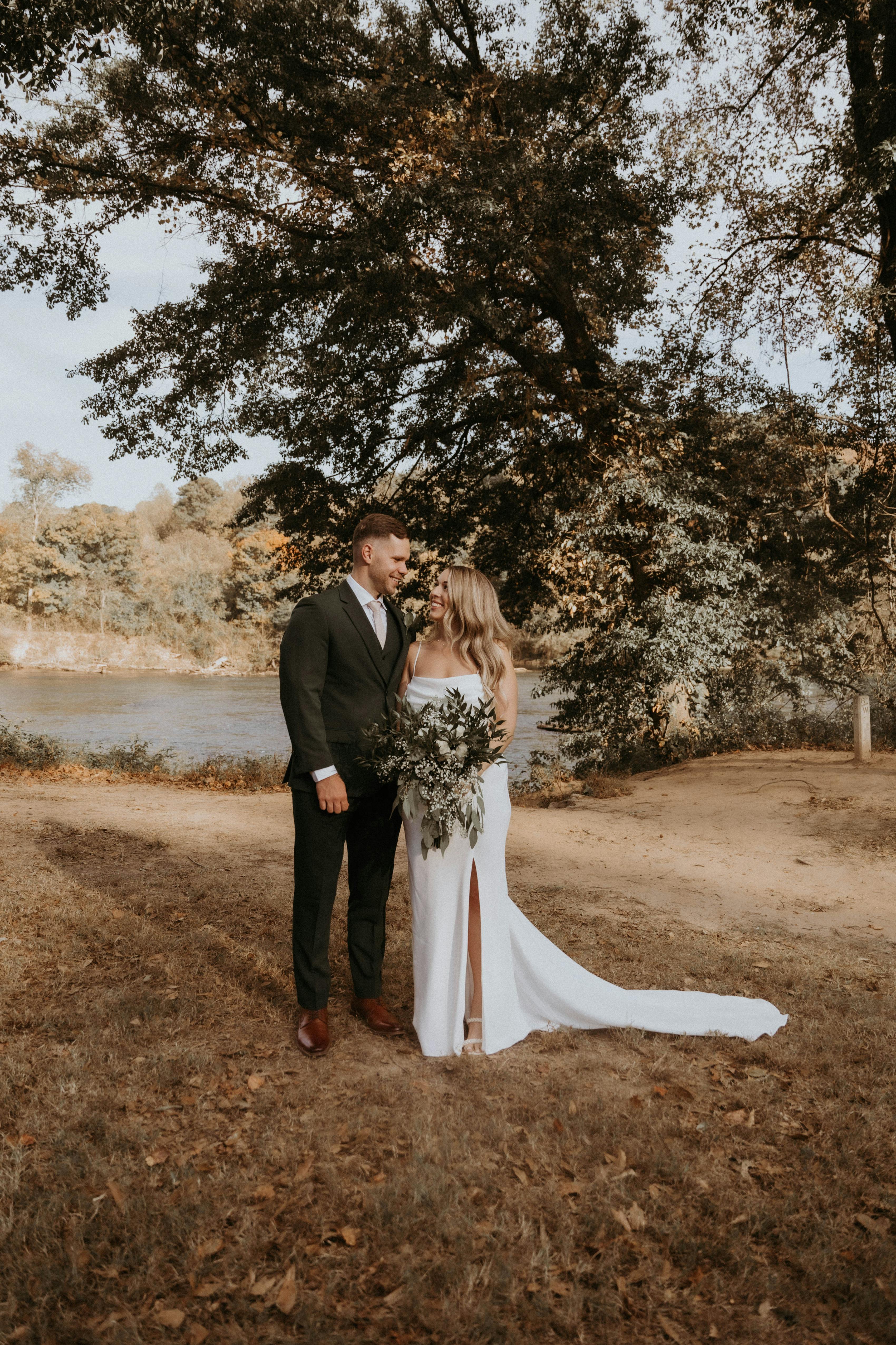 Sleek simple Grace Loves Lace bride with dark green groom.