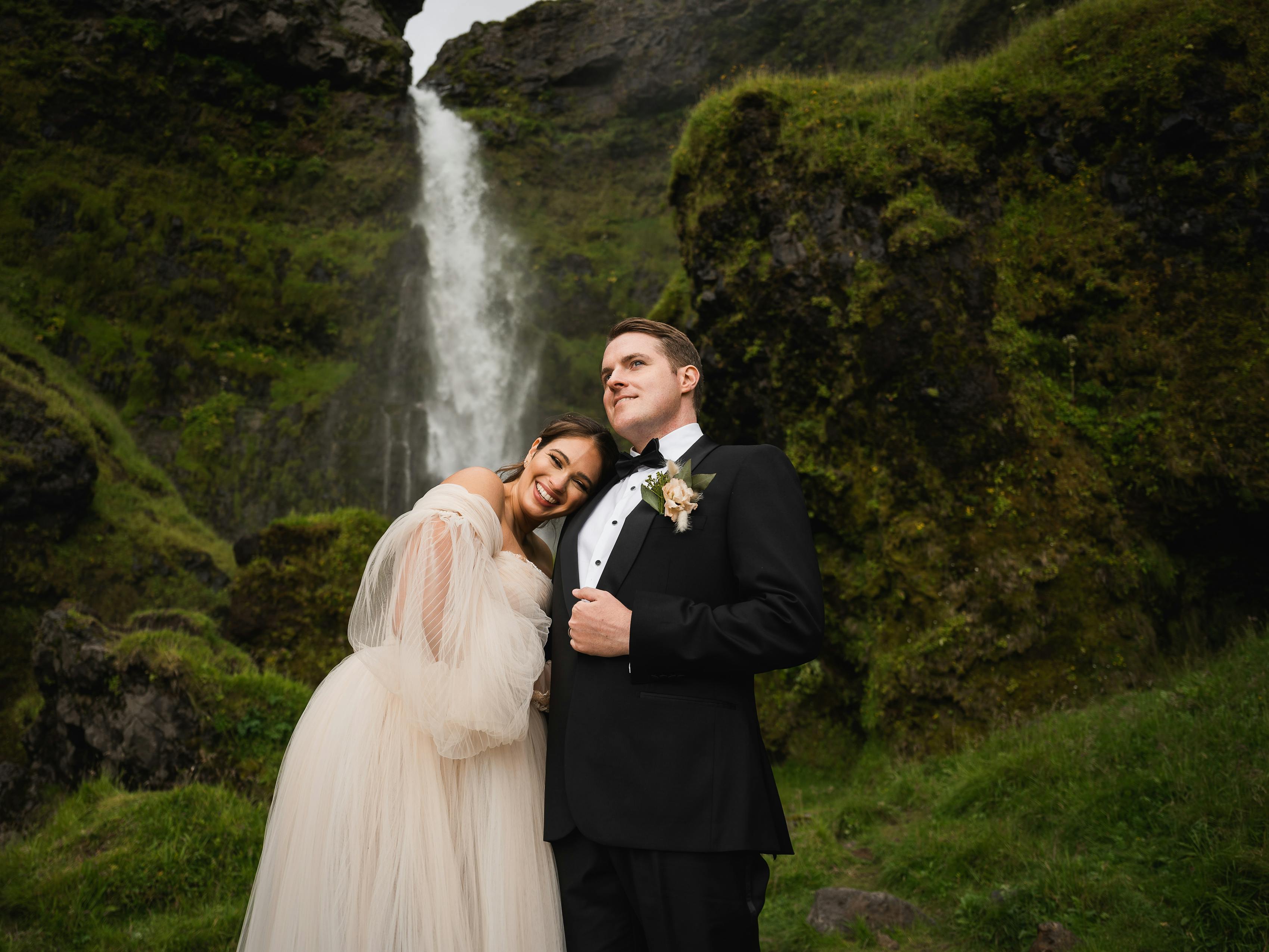 Black tie elegant elopement attire with black tuxedo and tulle off-white wedding ballgown.
