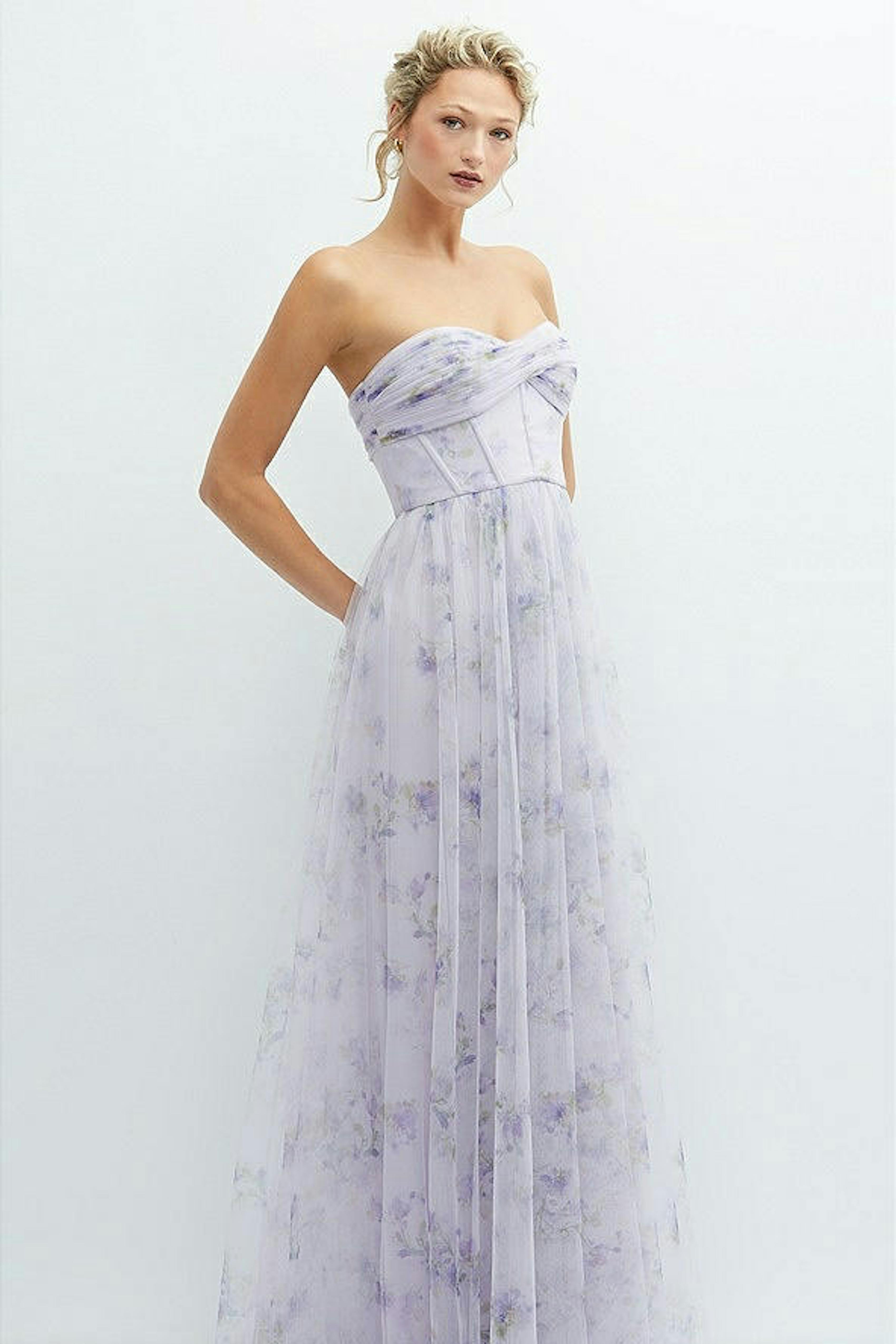 Lilac purple bridesmaid gown in floral tulle with crossover strapless corset.