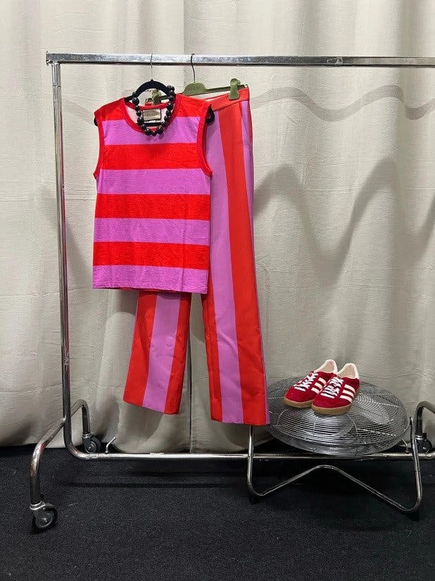 Harry Styles custom Gucci coordinating pink and red striped tailored set for Love on Tour performance.
