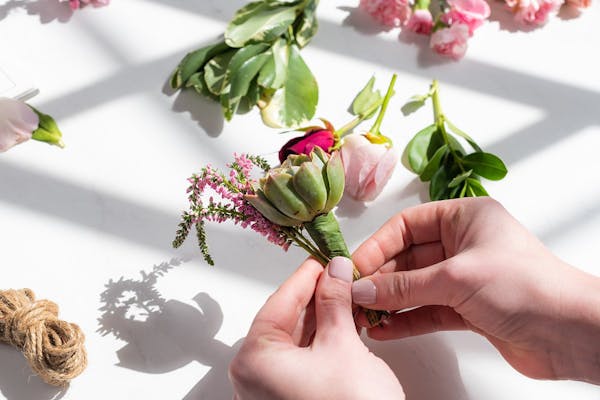 Supplies you need to make your own DIY wedding boutonniere for groomsmen.