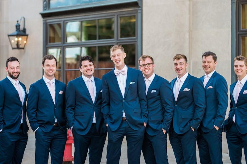Bright royal blue groomsman suits for blush pink and blue wedding party.