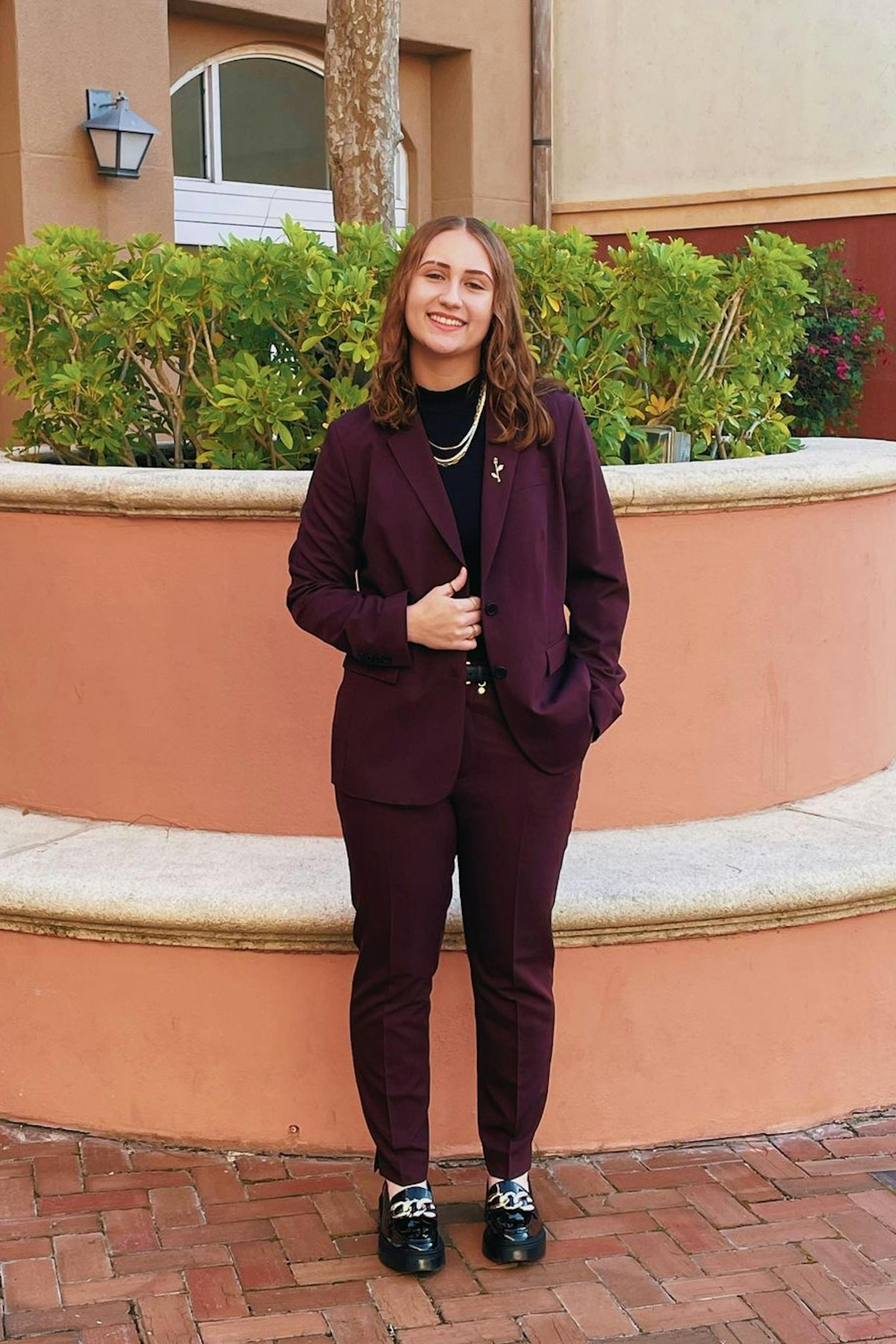 Girls homecoming dress alternative outfit in burgundy women's pantsuit.
