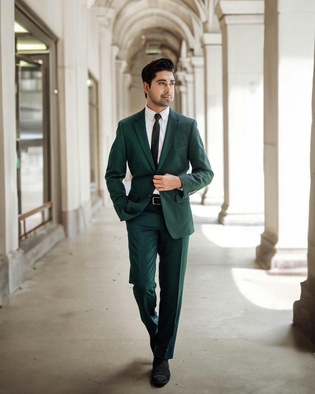 Dark green suit and tie to wear for business.