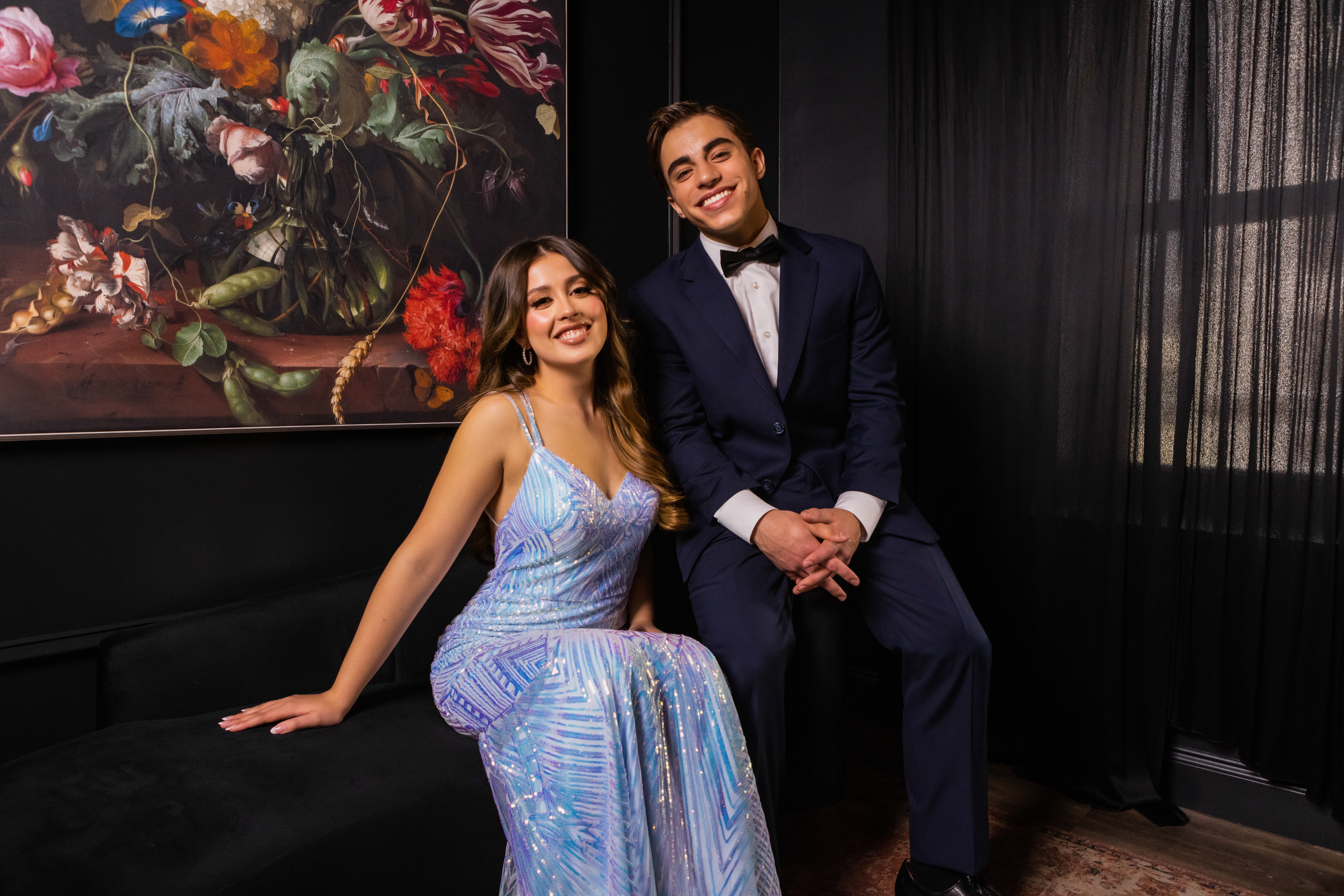 Formal homecoming outfits with a suit and evening gown for a school dance